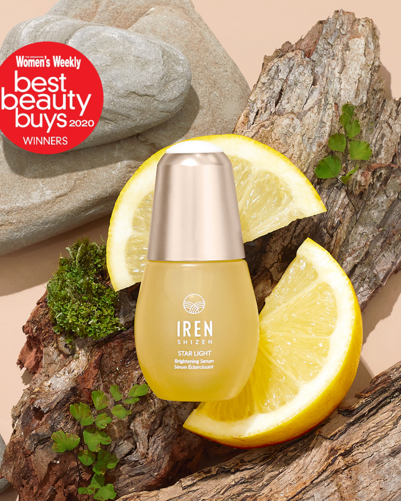 The STAR LIGHT Brightening Serum by IREN Shizen is shown on wood with lemon slices and a "Best Beauty Buys 2020" badge, emphasizing its ability to target dark spots and hyperpigmentation.