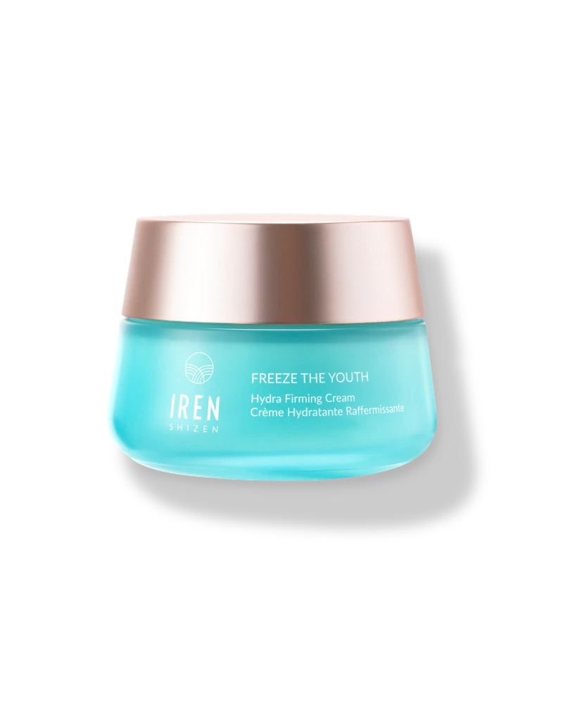 A blue jar of IREN Shizen FREEZE THE YOUTH Hydra Firming Cream with a rose gold metallic lid is shown on a plain white background.