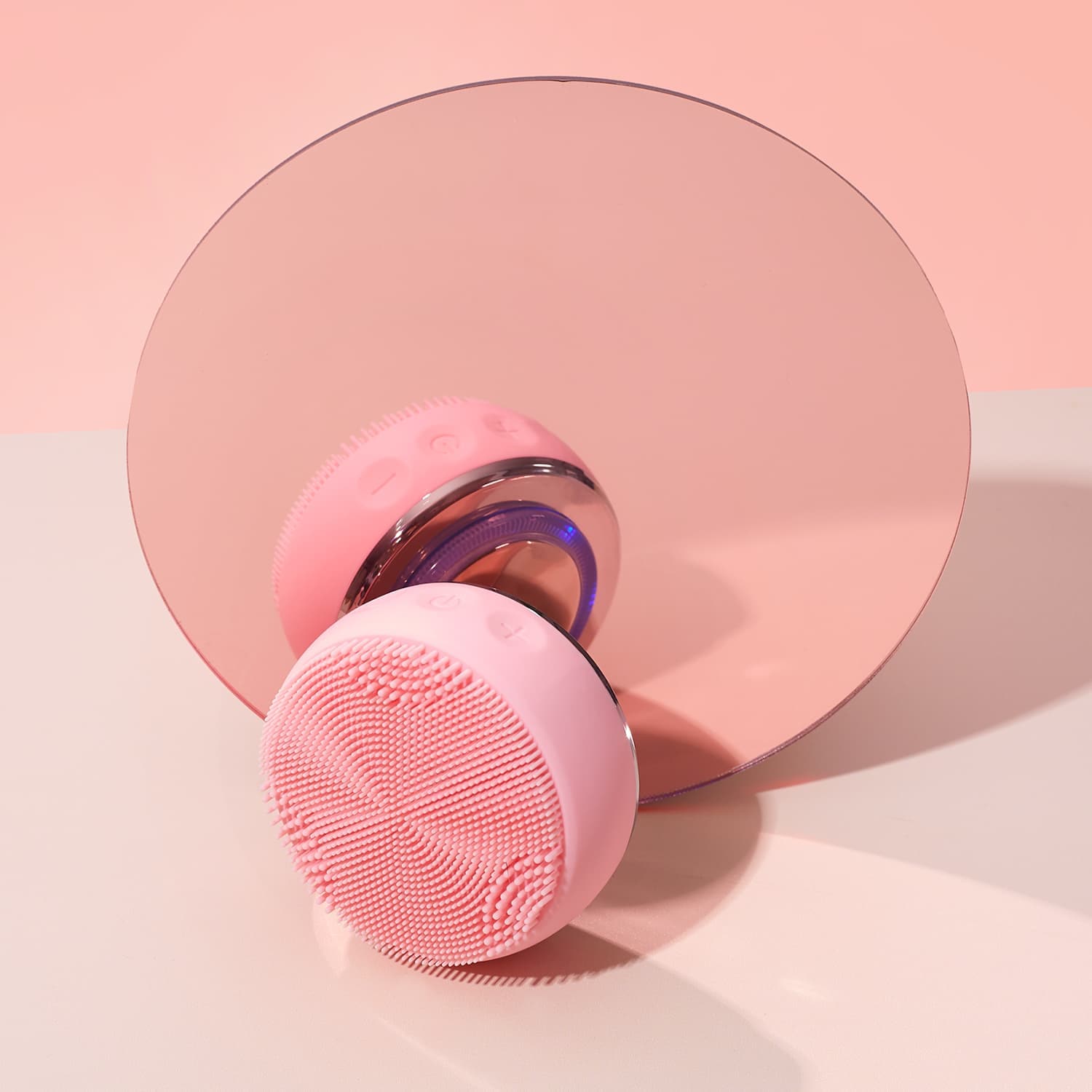 The IREN Shizen SKIN GENIE PRO Hydration Set is displayed in pink in front of a round pink mirror on a light pink and white surface.
