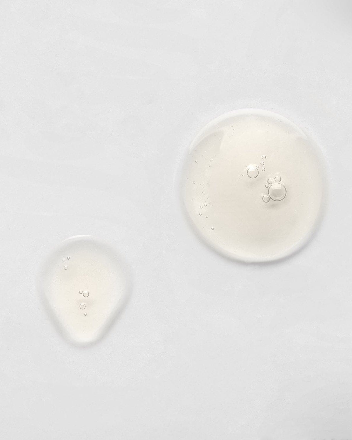 A group of custom skincare IREN Shizen KEEP CALM Soothing Serum circles on a white surface. #all-groups