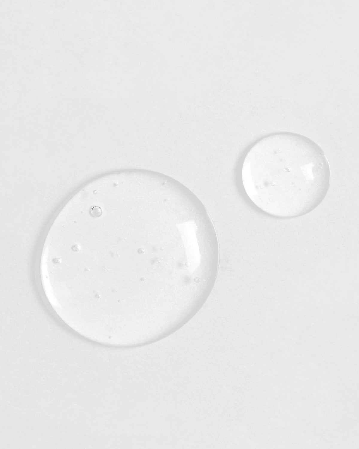 Two Japanese QUENCH-UP Hydrating Serum drops on a white surface. #all-groups
