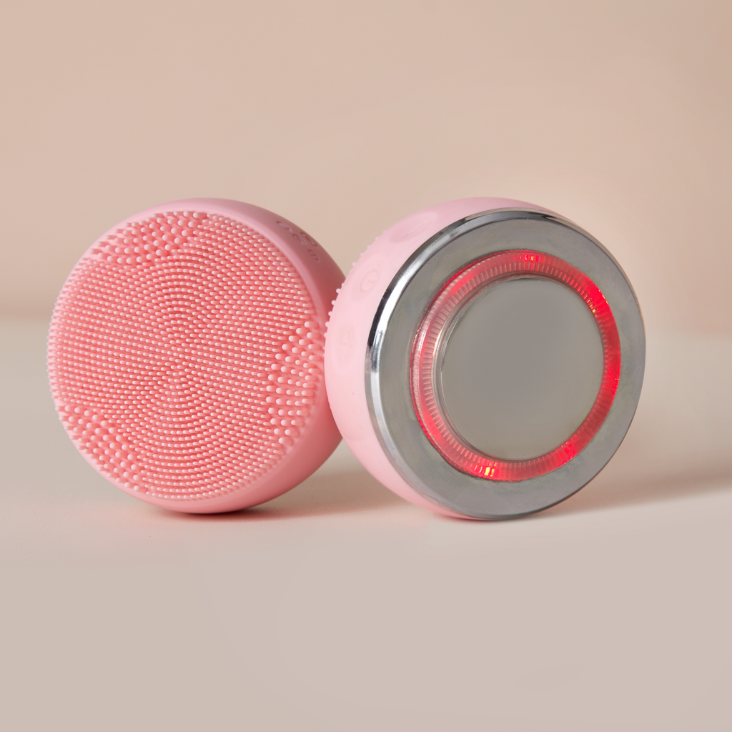 A Japanese skincare device, the IREN Shizen SKIN GENIE PRO Cleansing Brush, features customizable skincare benefits and LED light therapy with a red light.