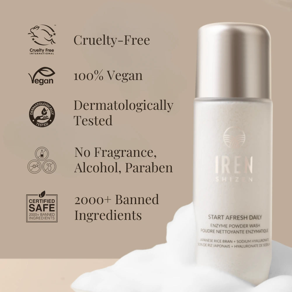 A bottle of IRÉN Shizen START AFRESH DAILY Enzyme Powder Wash on a beige background, with text noting its cruelty-free, vegan, dermatologically tested, and safe ingredients. This gentle daily exfoliant doubles as a rice enzyme cleanser.