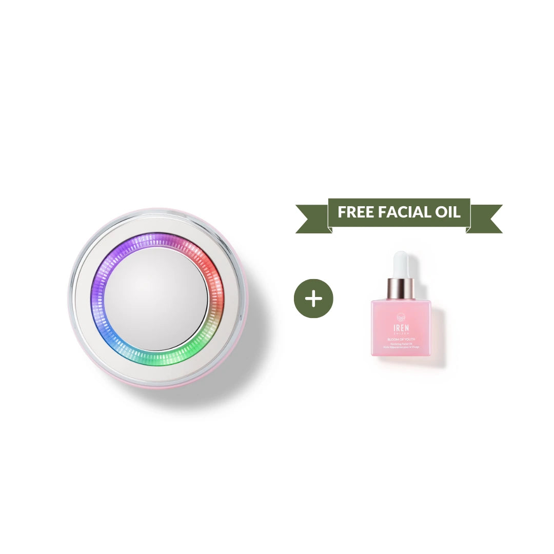 The IREN Shizen SKIN GENIE PRO Hydration Set, featuring a round facial cleansing device with colored LED light therapy, is displayed next to a pink bottle of facial oil labeled "FREE FACIAL OIL" on a green banner. #show-lang-en #all-groups