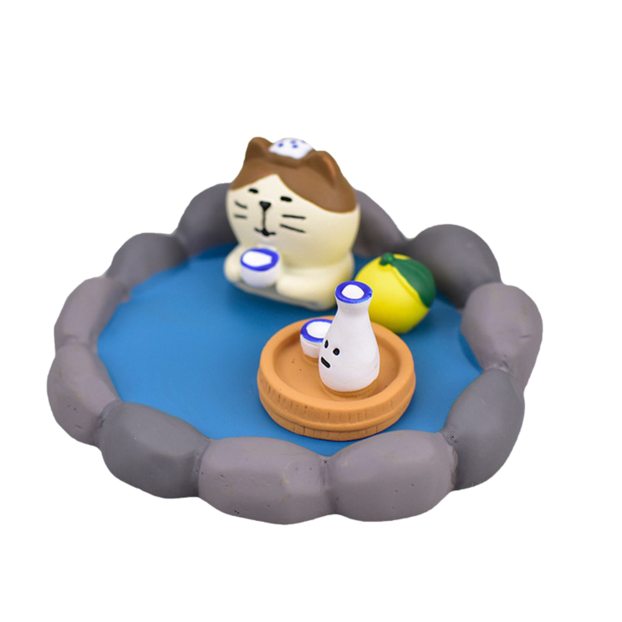 A small IREN Shizen cat figurine from the FREE GIFT Biyu Neko Blind Box relaxes in a stone bath with a towel, holding a cup beside a tray—ideal for collectible fans and surprise lovers.