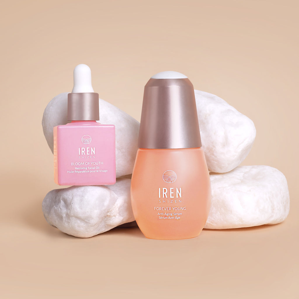 A bottle of BEST SUSTAINABLE DUO By L'OFFICIEL Beauty Awards 2023 ageless beauty serum and a bottle of BEST SUSTAINABLE DUO By L'OFFICIEL Beauty Awards 2023 restoring facial oil by IREN Shizen.