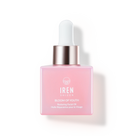 A pink glass dropper bottle of IREN Shizen BLOOM OF YOUTH Restoring Facial Oil, a lightweight oil with prebiotics and postbiotics for skin barrier repair, is displayed against a white background.