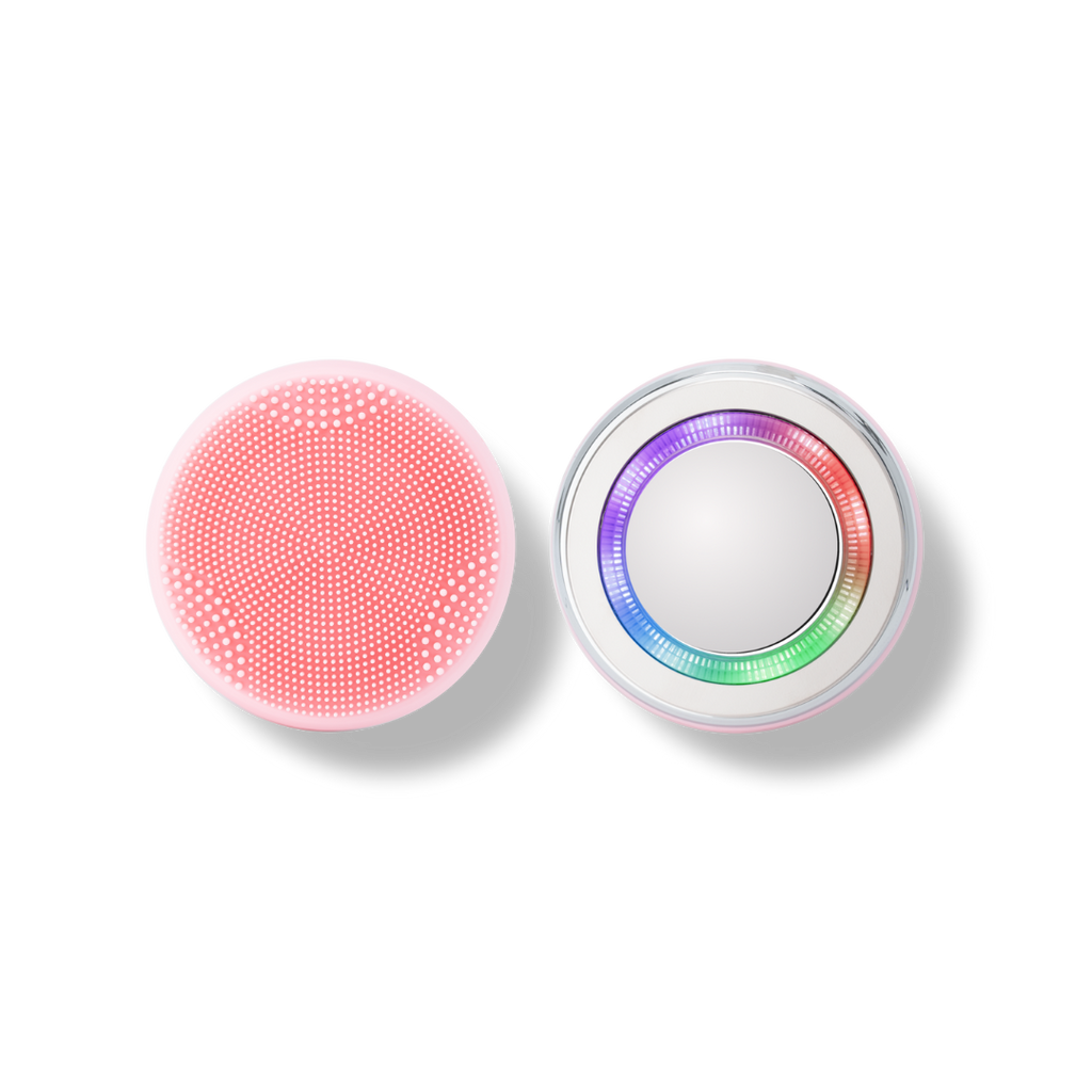 A pink and white SKIN GENIE PRO Cleansing Brush + LED Light Therapy button on a black background, offering customized skincare.