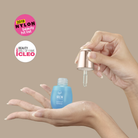 A hand dispenses QUENCH-UP Hydrating Serum from an IREN Shizen dropper bottle onto another hand. Nylon Beauty Hit List 2019 and Cleo Beauty Hall of Fame badges spotlight this plump skin hero.