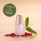 A bottle of SKIN REBOOT Antioxidant Serum by IREN Shizen is shown with pomegranate seeds, a green leaf, and a badge that recommends it for reducing dark circles and eye bags.