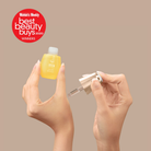A person holds an open STAR LIGHT Brightening Serum bottle and dropper by IREN Shizen. A red badge reads "Women's Weekly Best Beauty Buys 2020 WINNERS," highlighting its dark spot and hyperpigmentation benefits.