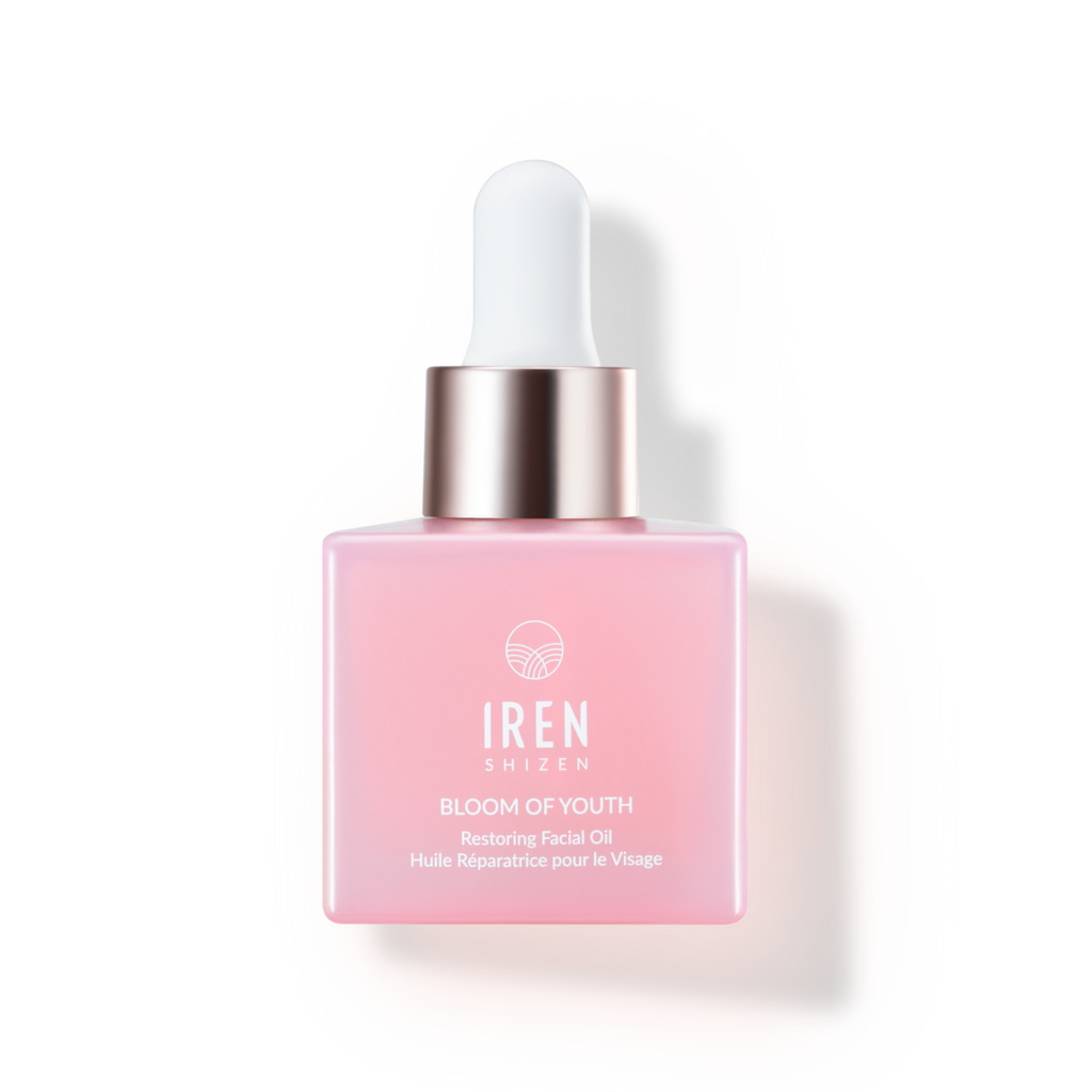 A bottle of IREN Shizen's BLOOM OF YOUTH Restoring Facial Oil, a Japanese skincare product, on a white background.