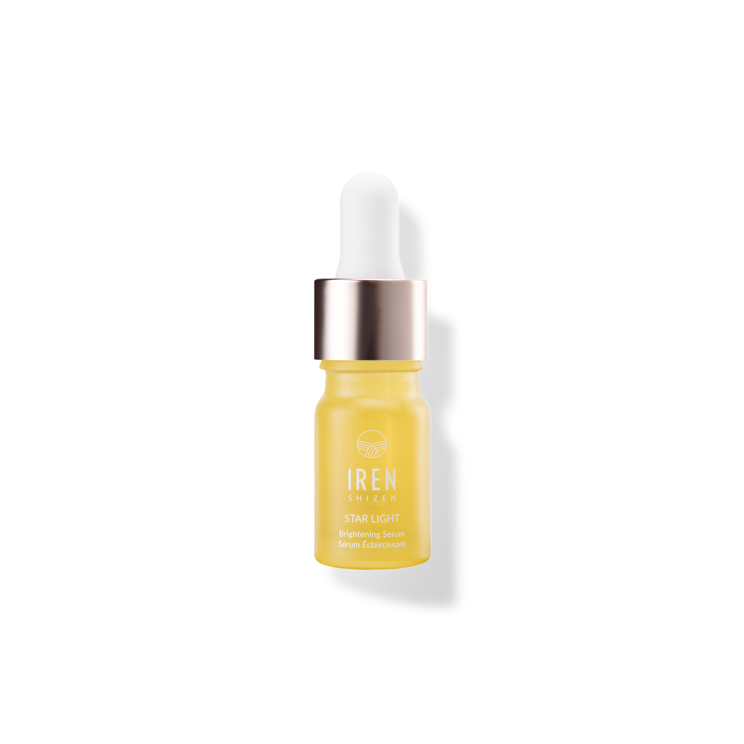 A bottle of STAR LIGHT Brightening Serum by IREN Shizen on a black background.